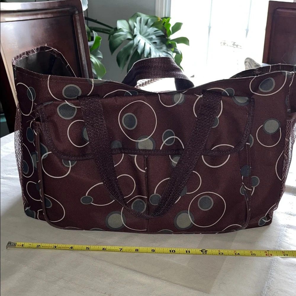 All purpose Brown Polka Dot Vinyl Tote Bag Open at top with side pockets.